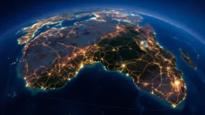 Aerial view of African continent at sunset showing illuminated network of light pathways connecting major cities across borders